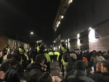 crowd of people police on horses outside Tottenham Chelsea London derby