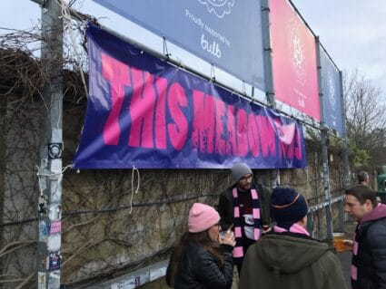 Sign saying "This Meadow is Ours" at Champion Hill, the home of Dulwich Hamlet FC in South London.
