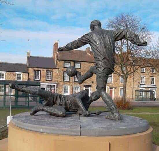 statue two men playing english football West Auckland, County Durham