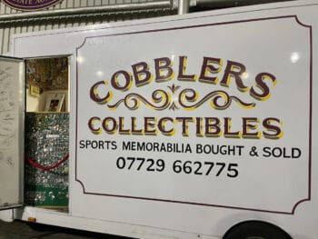 van with a sign saying cobblers collectibles