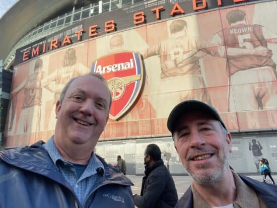 Two football supporters outside The Emirates Stadium.