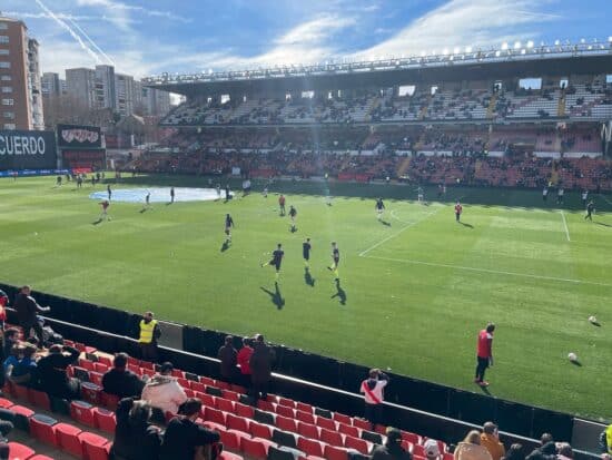 Players warming up on the pitch at Rayo Vallecano