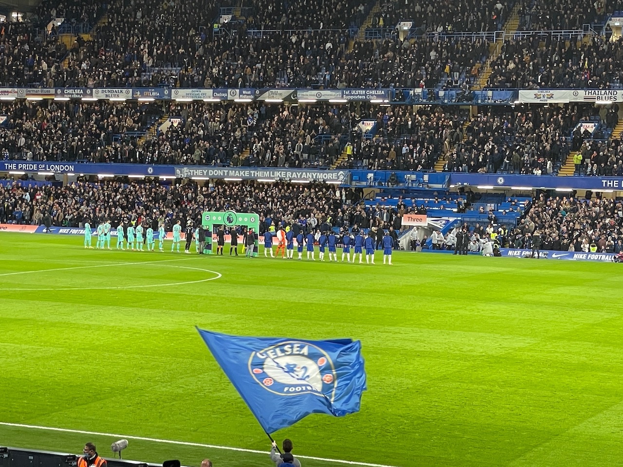 football players on the field at Chelsea FC before a game.