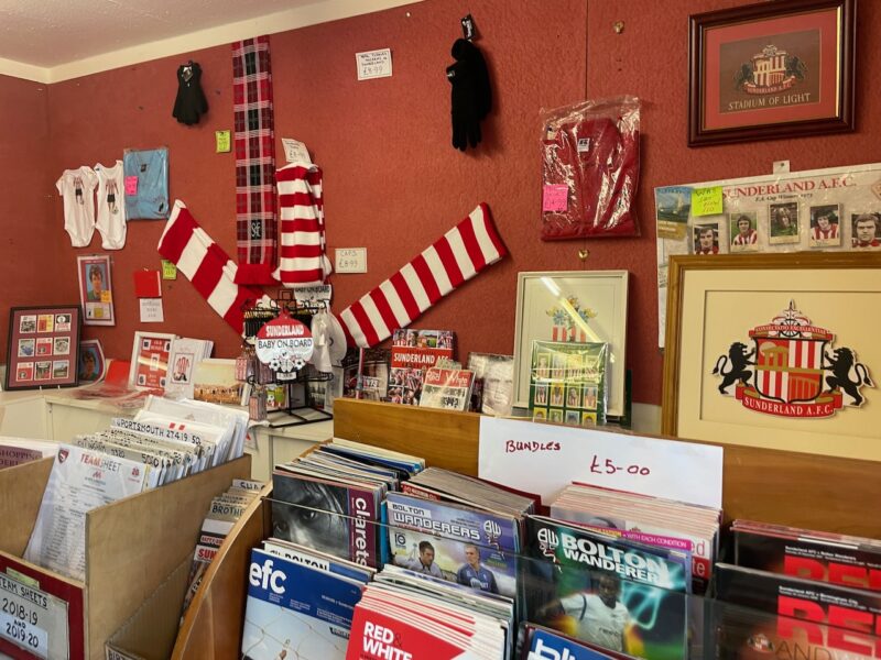 scarves, programs and other football memorabilia on display