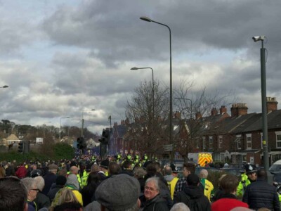 Cops on horses, getting the Ipswich folks to the station.