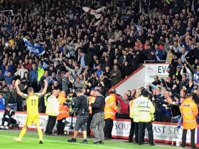 english football culture fans in stadium cheering