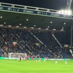 West Bromwich Albion fans watching a football game at The Hawthorns.