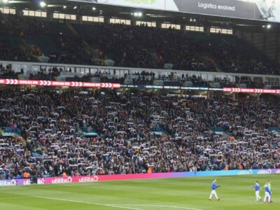Fans waving scarves before a game at Elland Road, home of Leeds United.