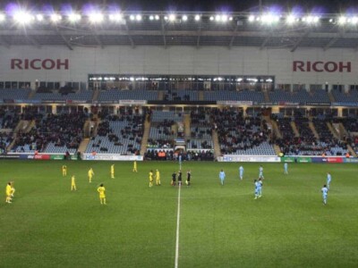 Players on the field for kickoff at Coventry City FC.