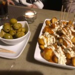 <I>Patatas bravas</I> and olives, on the tapas tour.