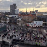 view of buildings and pedestrians outside Arsenal The Emirates