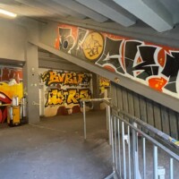 graffiti on walls in a stadium concourse