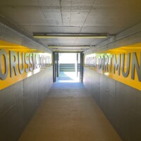 inside the plauyers' tunnel at Borussia Dortmund, with the name written on each wall
