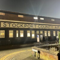 exterior of a football ground with the words "Stockport County AFC" written on it