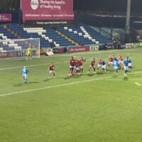 football players taking a free kick