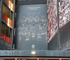 Valencia is used to winning things, as they like to remind visitors to their stadium. an image of trophies on the side of a footbal stadium